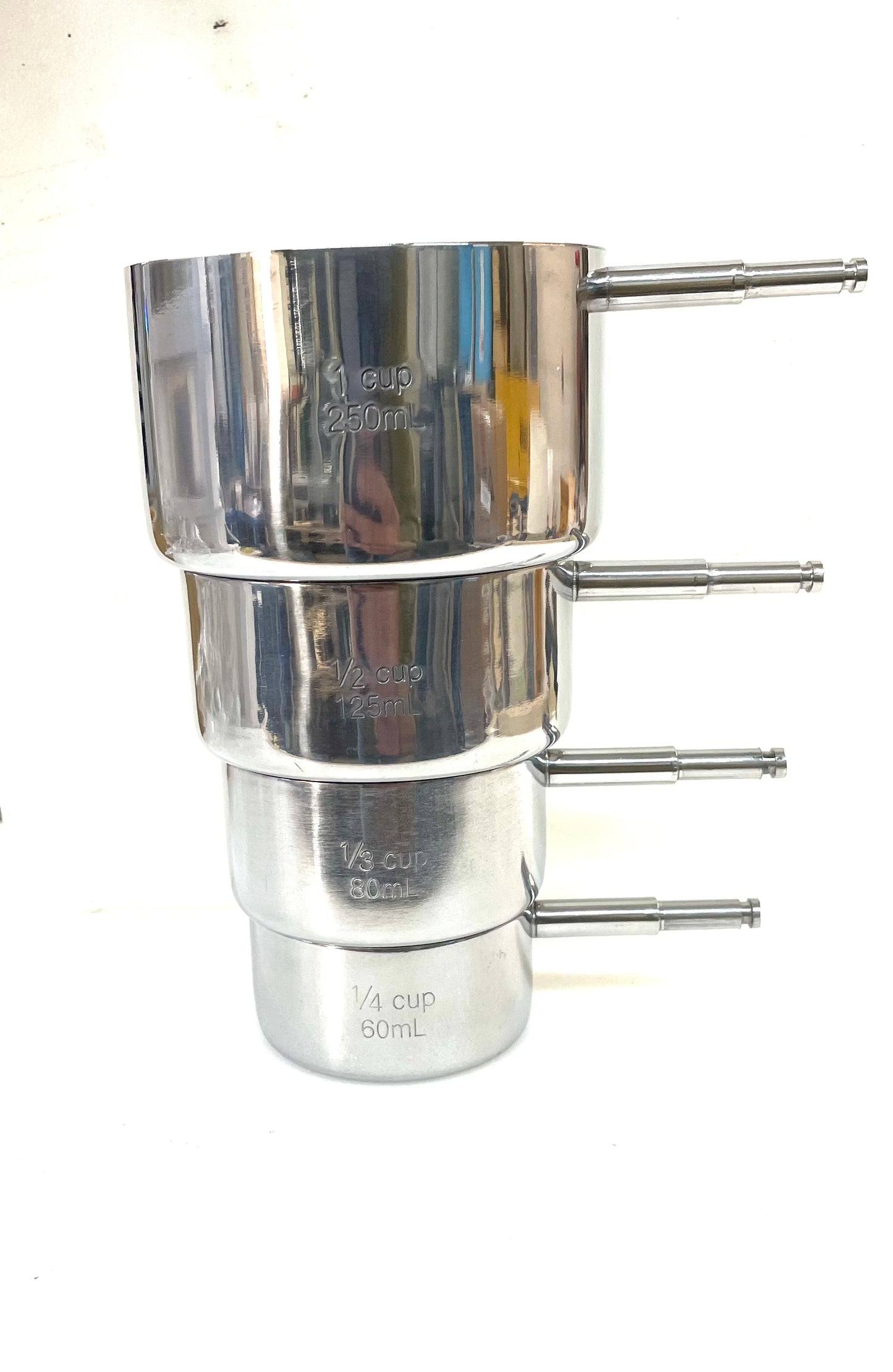 Stainless steel measuring cup turning kit